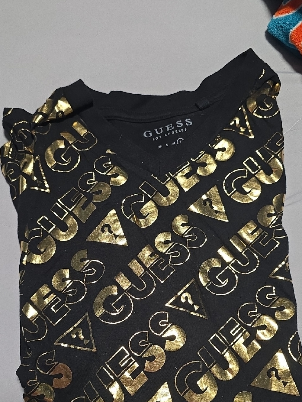 GUESS Black Tee with Metallic Gold All-Over Logo